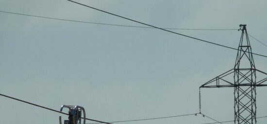 Outdoor photograph of a LineVue unit inspecting a live transmission cable