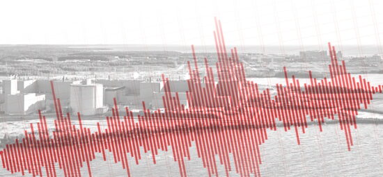 A seismic chart overlaid on top of a picture of a nuclear plant