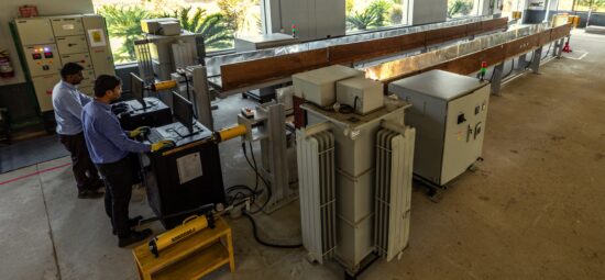 Workers preparing thermo-mechanical test bay for endurance tests