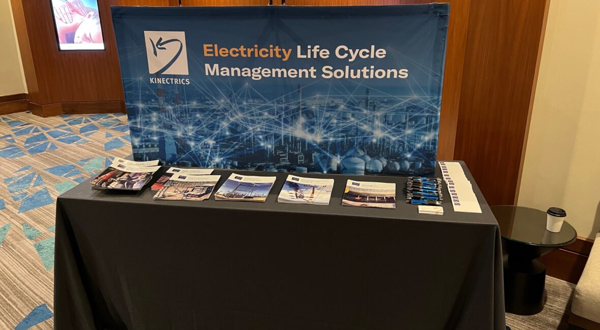Kinectrics booth lined with brochures at the 2022 ICC fall meeting
