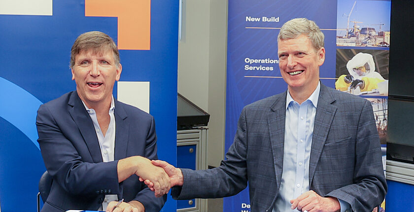 Kinectrics and Ontario Tech handshake after signing memorandum of understanding