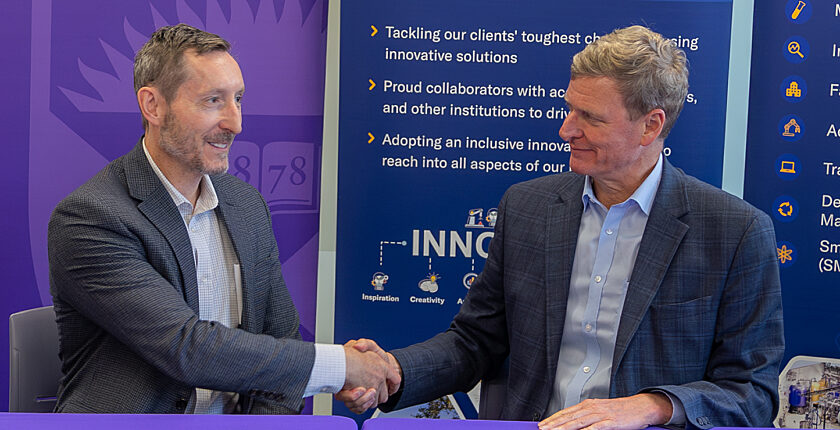 Kinectrics and Western University handshake after signing memorandum of understanding