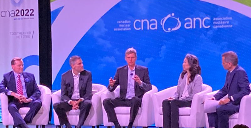 Photograph of David Harris on stage during the CNA 2022 panel "Innovation and the Transformation of Nuclear"