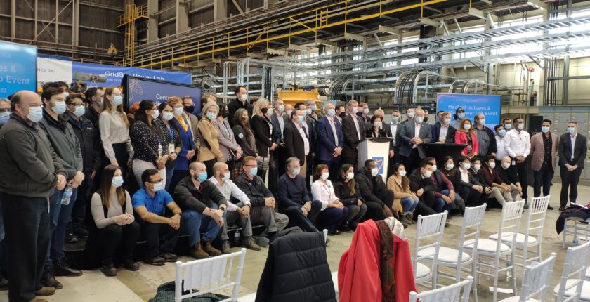 Industry representatives posing for a group photo at the GridSim grand opening