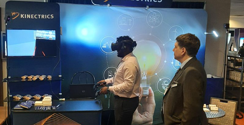 Kinectrics representatives performing a virtual reality demonstration at CNA 2022