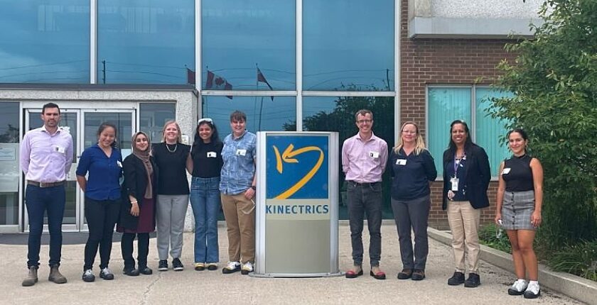 Tour group standing outside the Kinectrics headquarters entrance