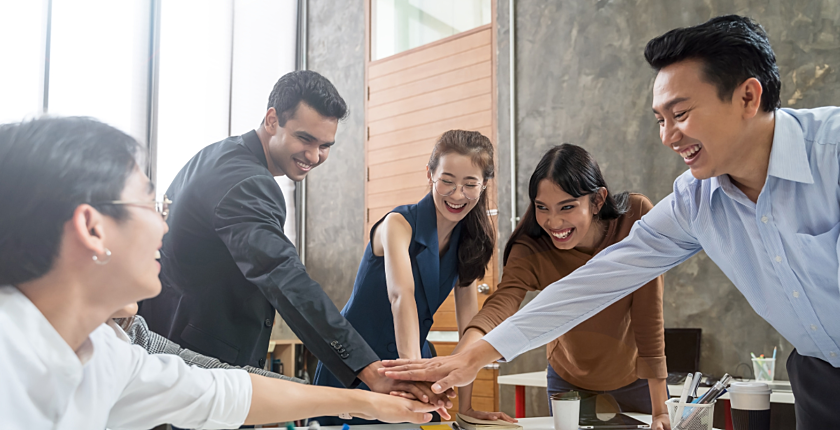 Group of people smiling during a group cheer