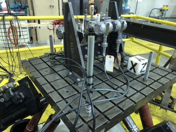 Machine part mounted onto a seismic table for testing