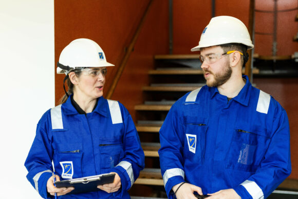 Kinectrics workers discussing the results of a pipe support survey
