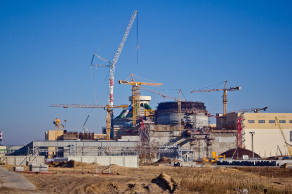 Cranes constructing a brand new nuclear facility