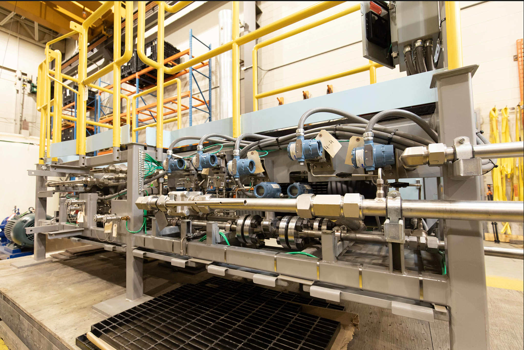 Large skid full of machinery with identification tags