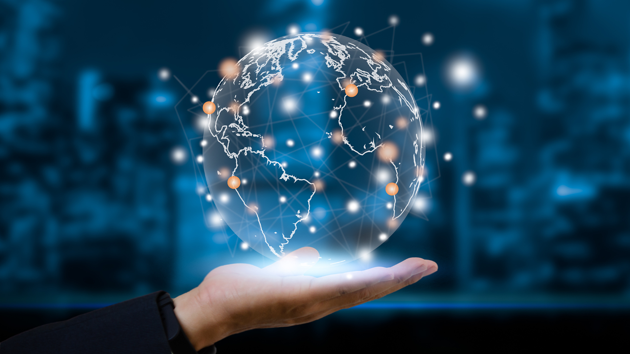 Abstract art of a hologram earth hovering above an outstretched hand