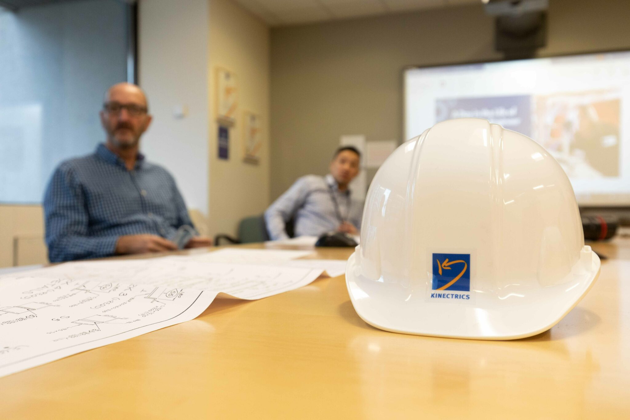 Close up of hardhat during Kinectrics boardroom meeting