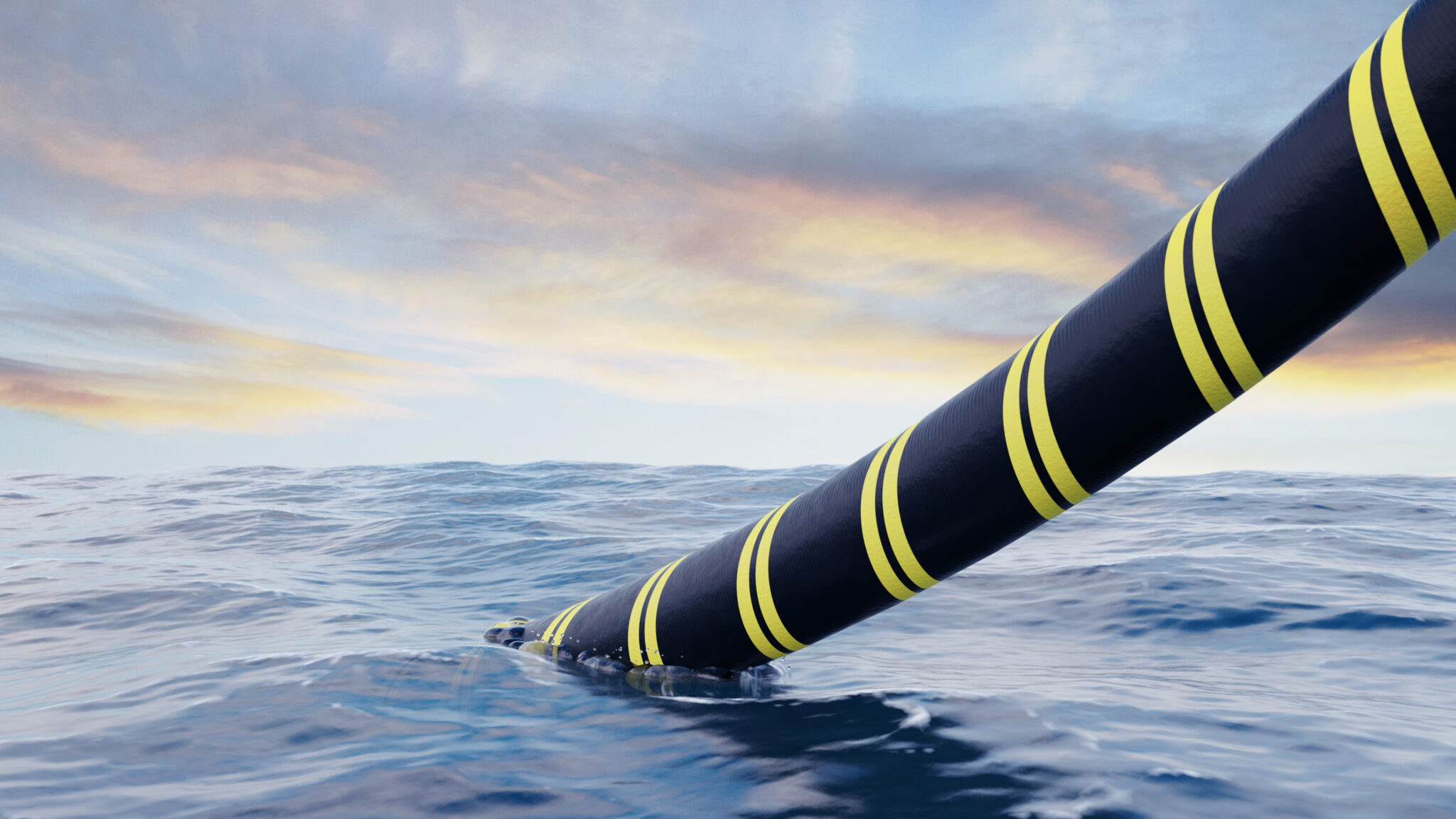 Large subsea cable exiting an ocean