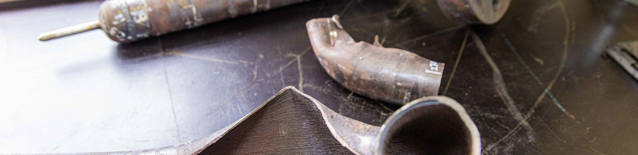 Forensics table featuring worn and burst pipes