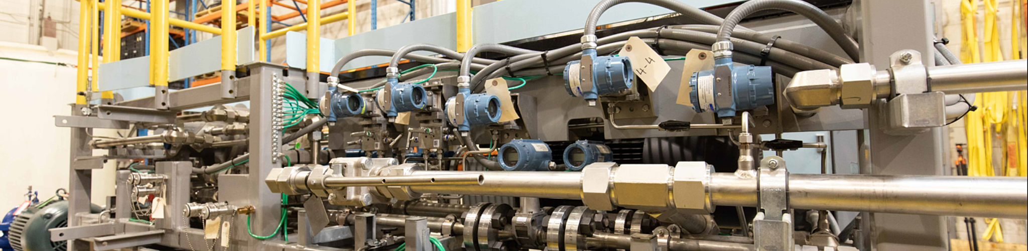 Large skid full of machinery with identification tags