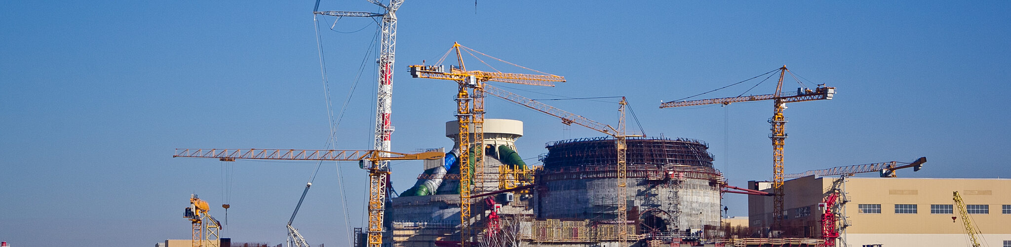 Cranes constructing a brand new nuclear facility